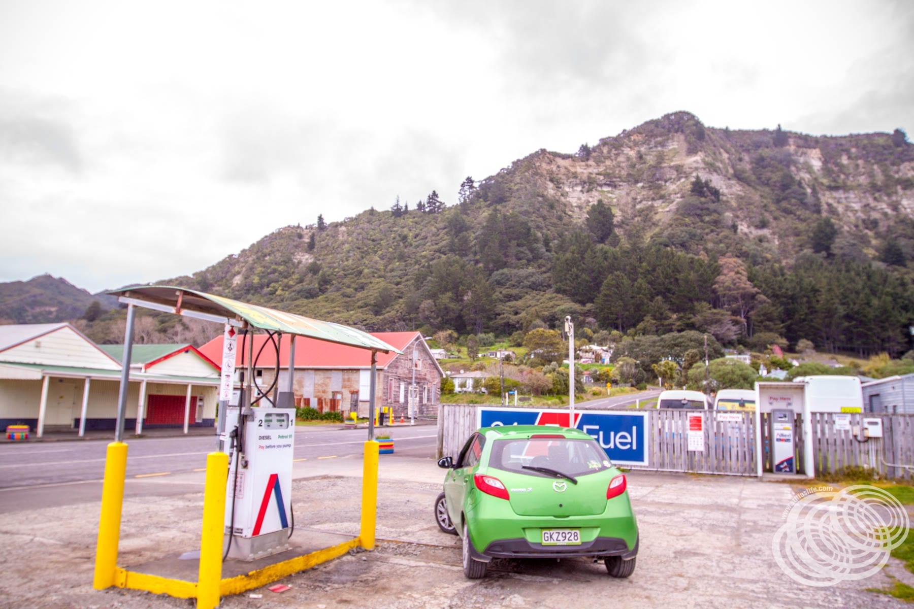 Our economical little Mazda 2 at the unmanned Allied service station in Te Araroa